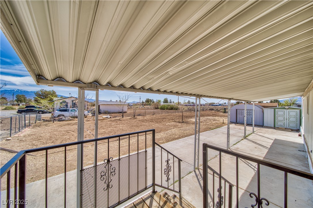 2631 Retread Road Pahrump, NV 89048 - Photo 5 of 18 View of patio with a storage shed and an outdoor structure