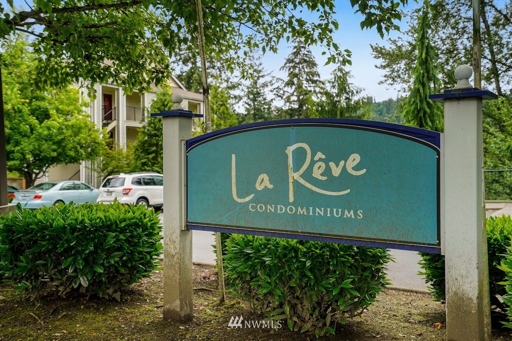10709 Valley View Road, Unit A105 Bothell, WA 98011 - Photo 2 of 26 a sign on the side of the road