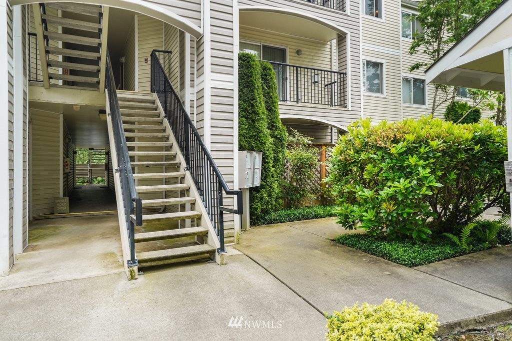 10709 Valley View Road, Unit A105 Bothell, WA 98011 - Photo 3 of 26 a view of front door and porch with seating space