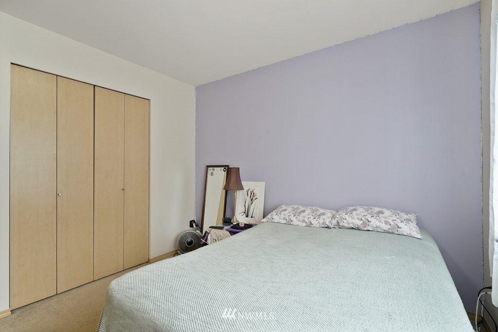 10709 Valley View Road, Unit A105 Bothell, WA 98011 - Photo 21 of 26 a bed room with a bed