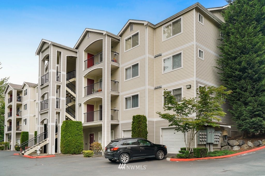 10709 Valley View Road, Unit A105 Bothell, WA 98011 - Photo 26 of 26 a car parked in front of a building