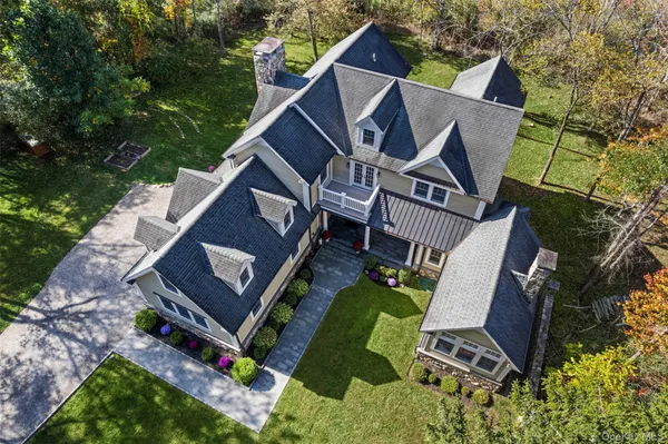 aerial view of a house with backyard