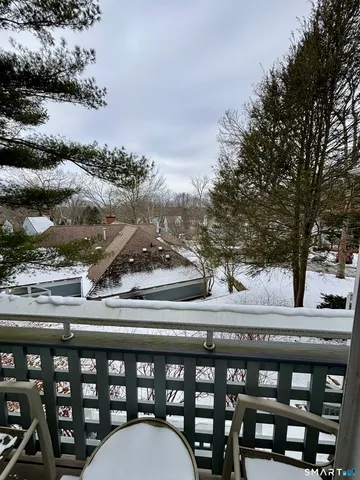 a view of a balcony with furniture