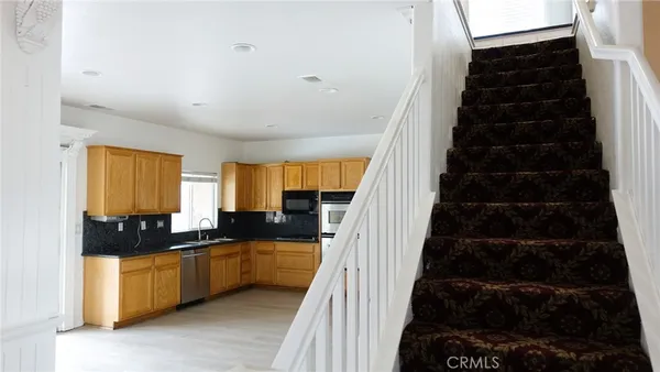 a kitchen with a sink and cabinets