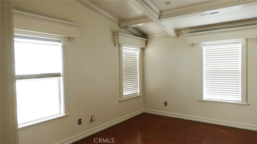 1415 Sunflower Way Perris, CA 92571 - Photo 19 of 39 an empty room with a window and wooden floor