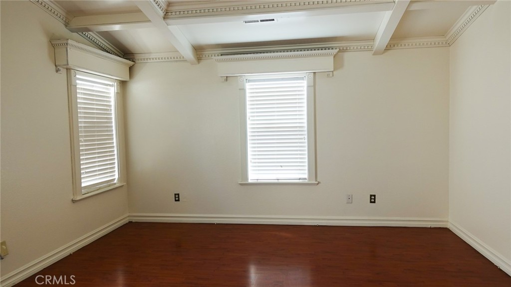 1415 Sunflower Way Perris, CA 92571 - Photo 21 of 39 an empty room with wooden floor and windows