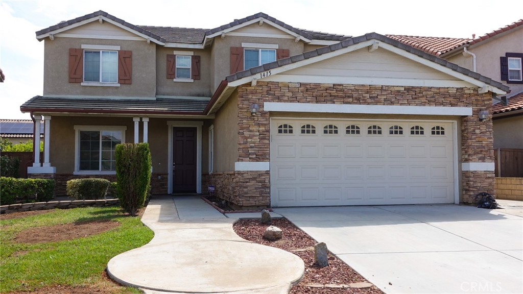 1415 Sunflower Way Perris, CA 92571 - Photo 39 of 39 a front view of a house with garden