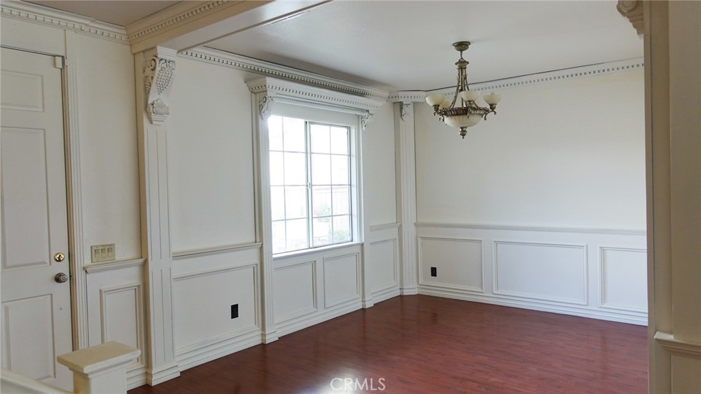 1415 Sunflower Way Perris, CA 92571 - Photo 5 of 39 a view of an empty room with wooden floor and a window