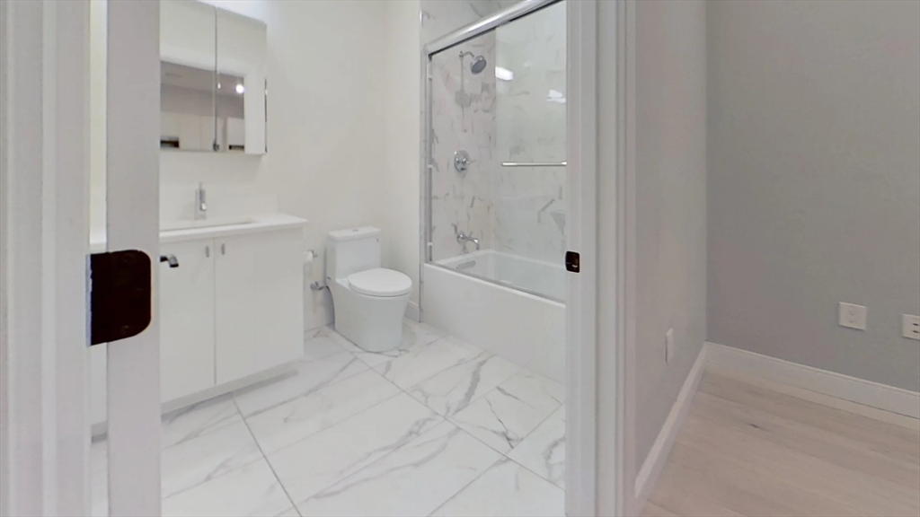 197 Green Street, Unit 207 Boston, MA 02130 - Photo 4 of 4 a bathroom with a toilet