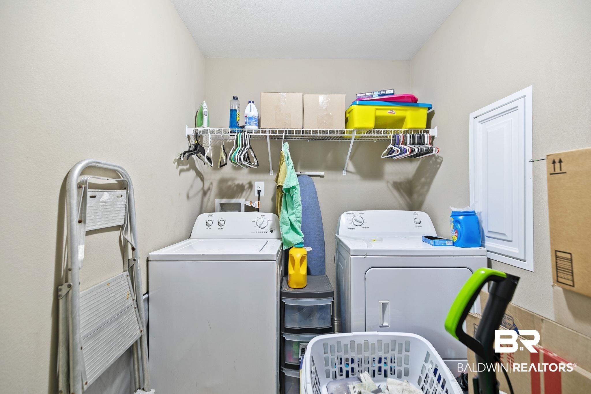 15573 Talus Court Foley, AL 36535 - Photo 27 of 50 Laundry room featuring cabinets and washer and clothes dryer