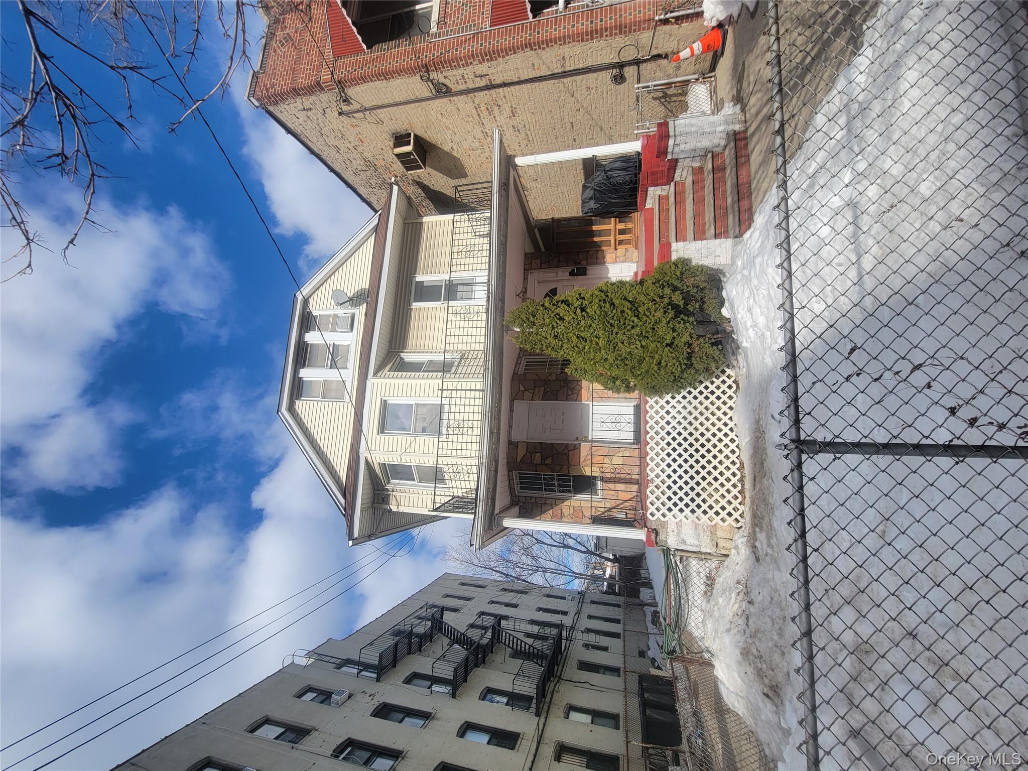 895 Lenox Road Brooklyn, NY 11203 - Photo 3 of 8 a front view of a house with a yard