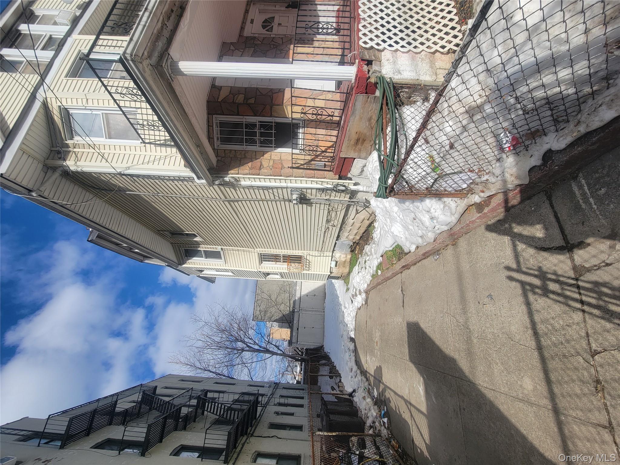 895 Lenox Road Brooklyn, NY 11203 - Photo 4 of 8 a view of a house with a patio
