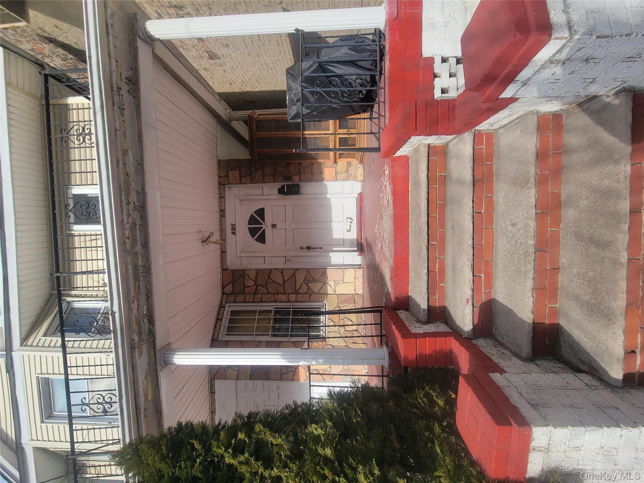 895 Lenox Road Brooklyn, NY 11203 - Photo 5 of 8 a front view of a multi story residential apartment building