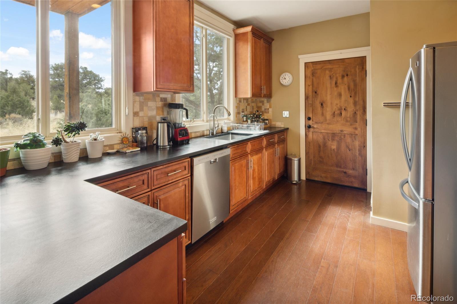 147 Moonlight Way Crestone, CO 81131 - Photo 13 of 47 a view of a kitchen with a large window