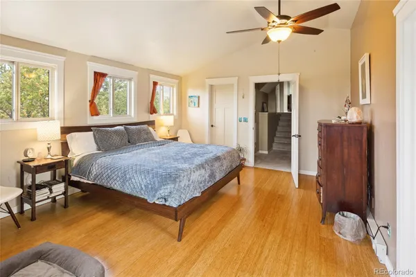 a view of a bedroom with furniture and a window