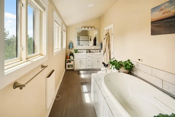 a bathroom with a shower and a sink