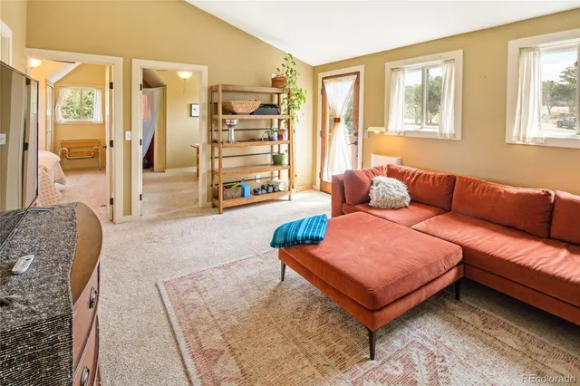 a view of balcony with wooden floor and seating space
