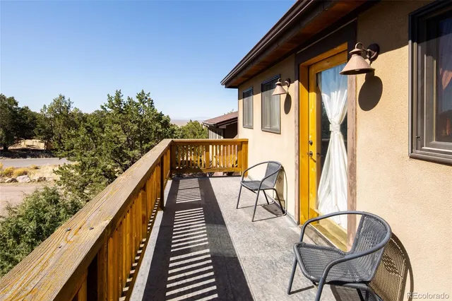 a view of balcony with furniture