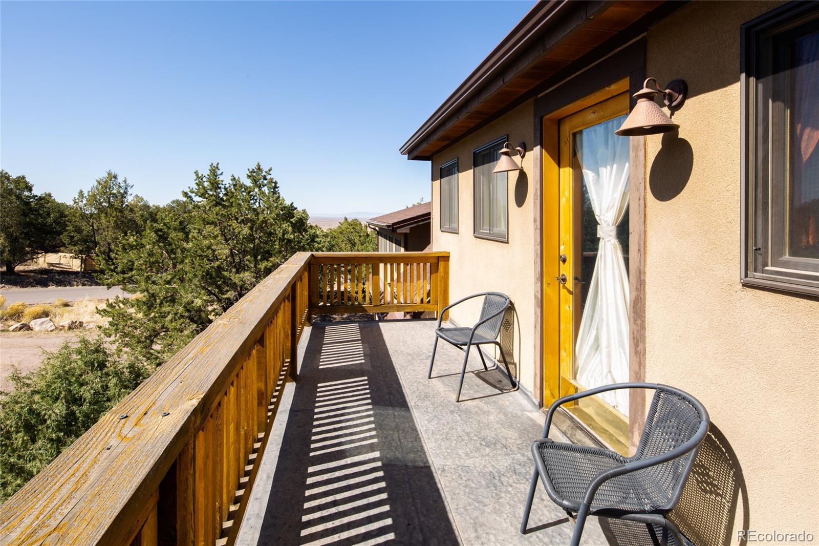 147 Moonlight Way Crestone, CO 81131 - Photo 30 of 47 a view of balcony with wooden floor and seating space