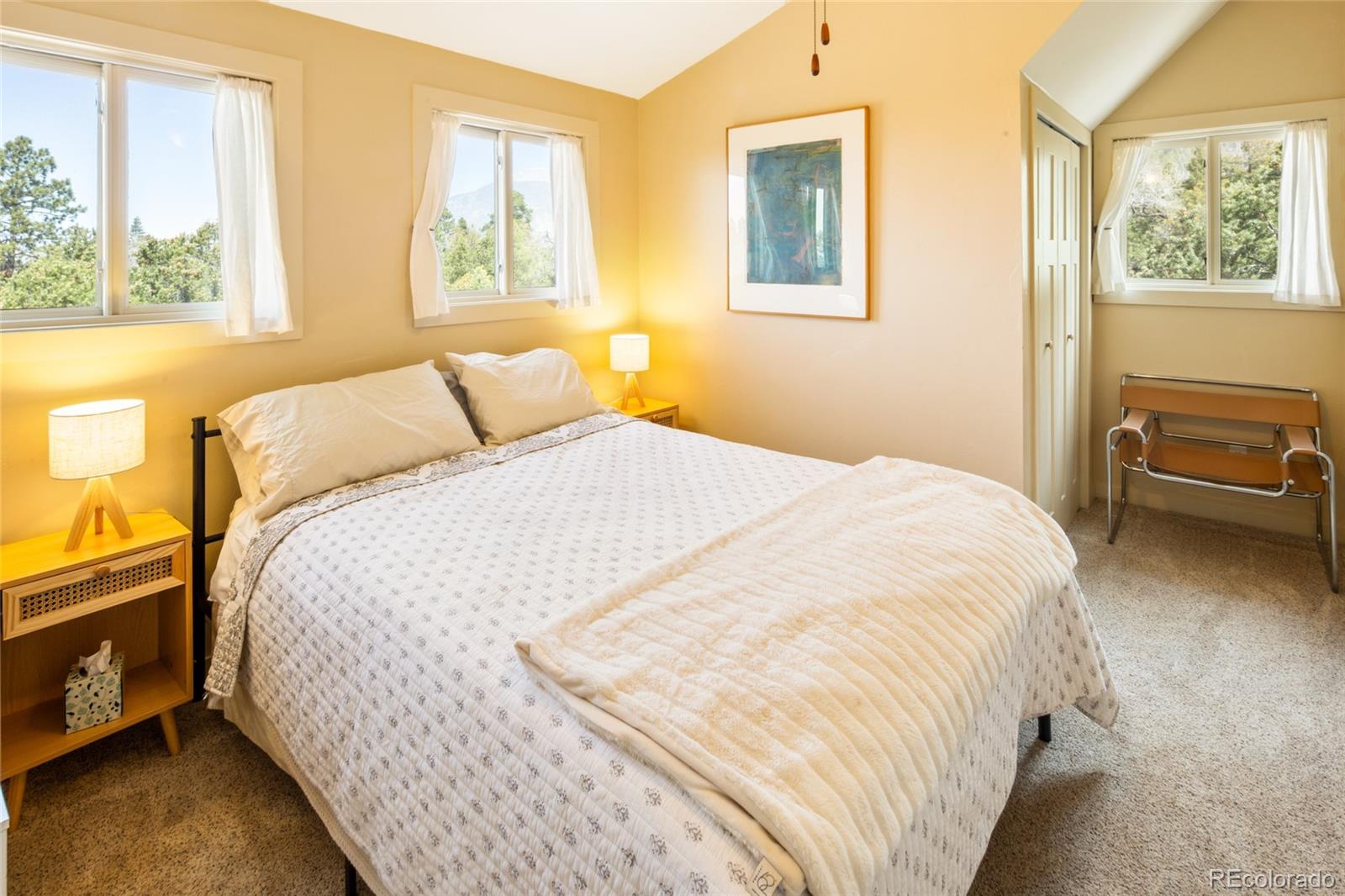 147 Moonlight Way Crestone, CO 81131 - Photo 32 of 47 a bedroom with a bed and wooden floor