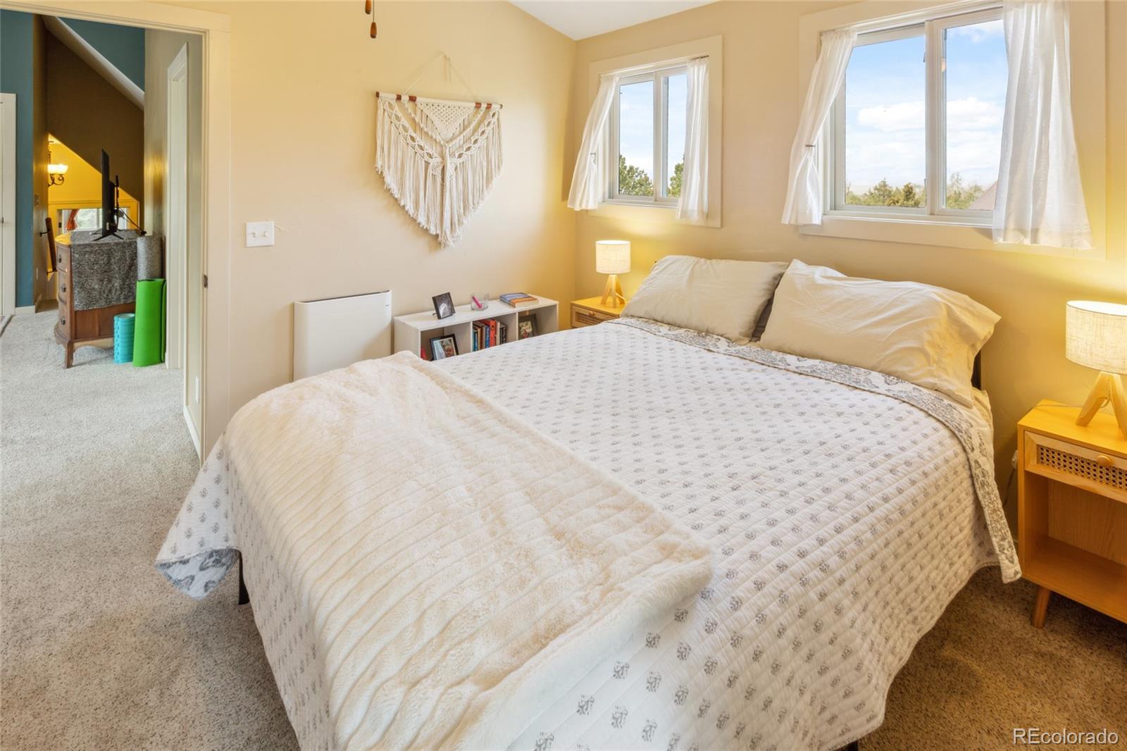 147 Moonlight Way Crestone, CO 81131 - Photo 33 of 47 a bedroom with a bed and window