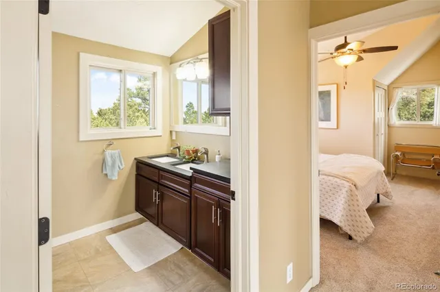 a bathroom with a tub and a chair