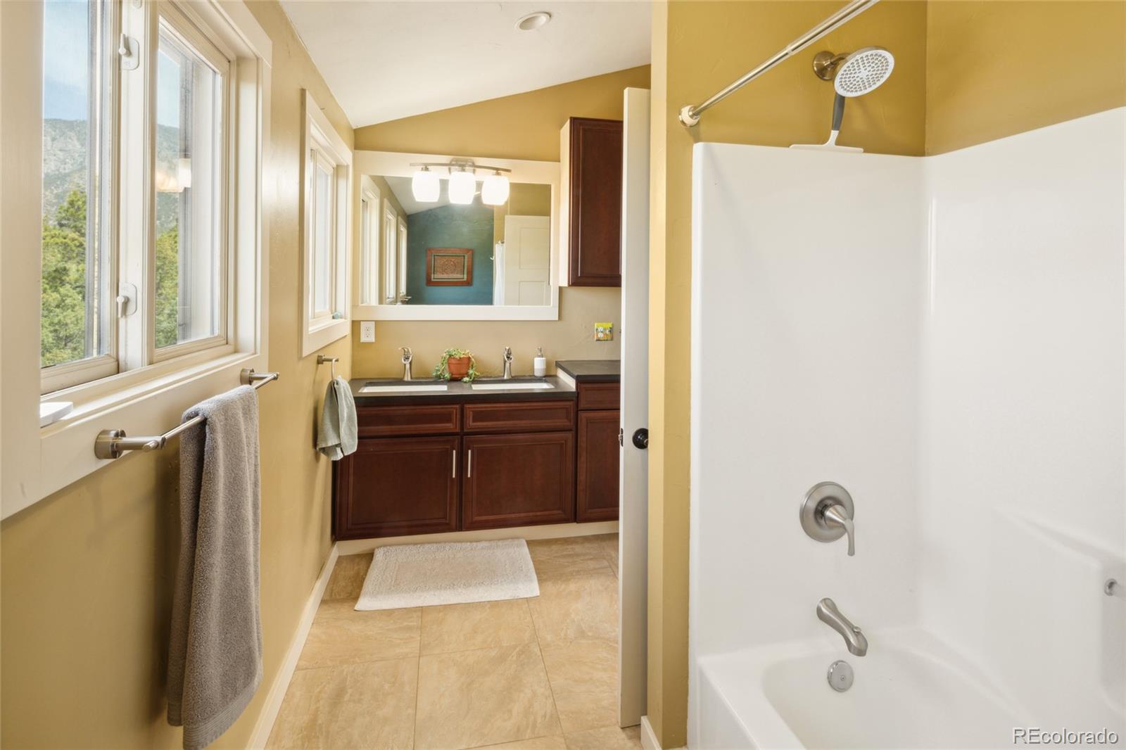147 Moonlight Way Crestone, CO 81131 - Photo 36 of 47 a bathroom with a tub sink and mirror