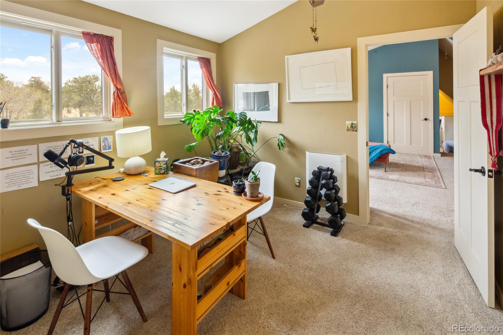 147 Moonlight Way Crestone, CO 81131 - Photo 38 of 47 a room with a table chairs and a refrigerator