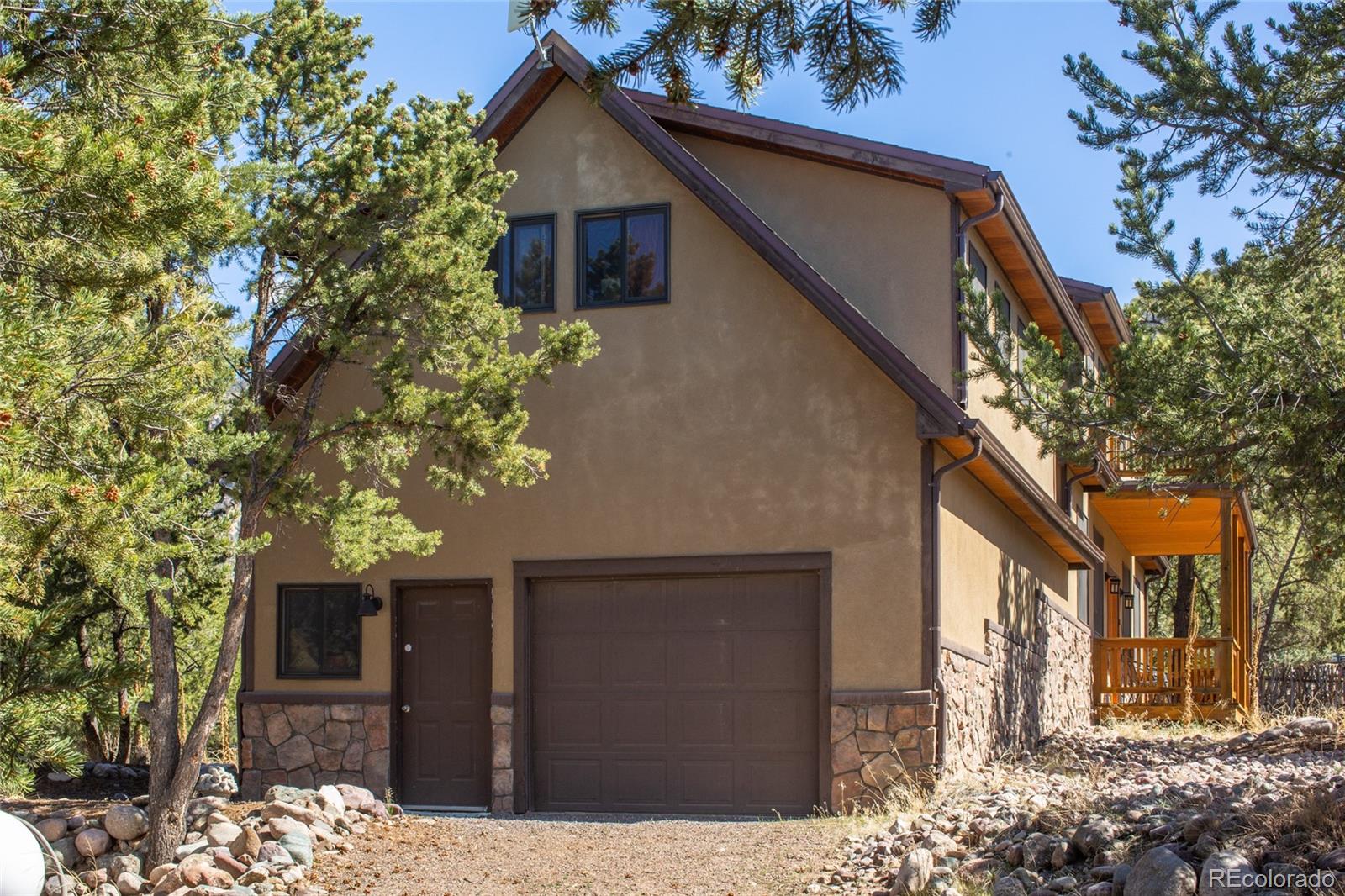 147 Moonlight Way Crestone, CO 81131 - Photo 39 of 47 a front view of a house with a tree