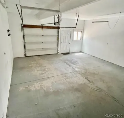 a view of a hallway with wooden shelves