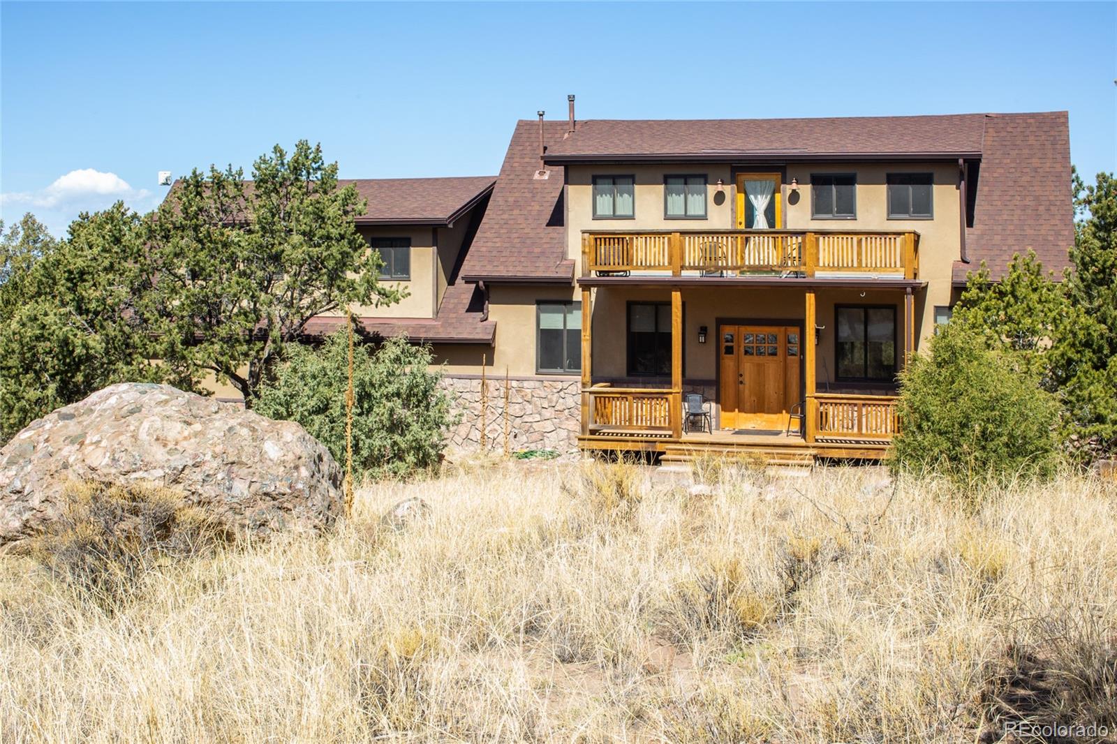 147 Moonlight Way Crestone, CO 81131 - Photo 4 of 47 front view of a house with a yard