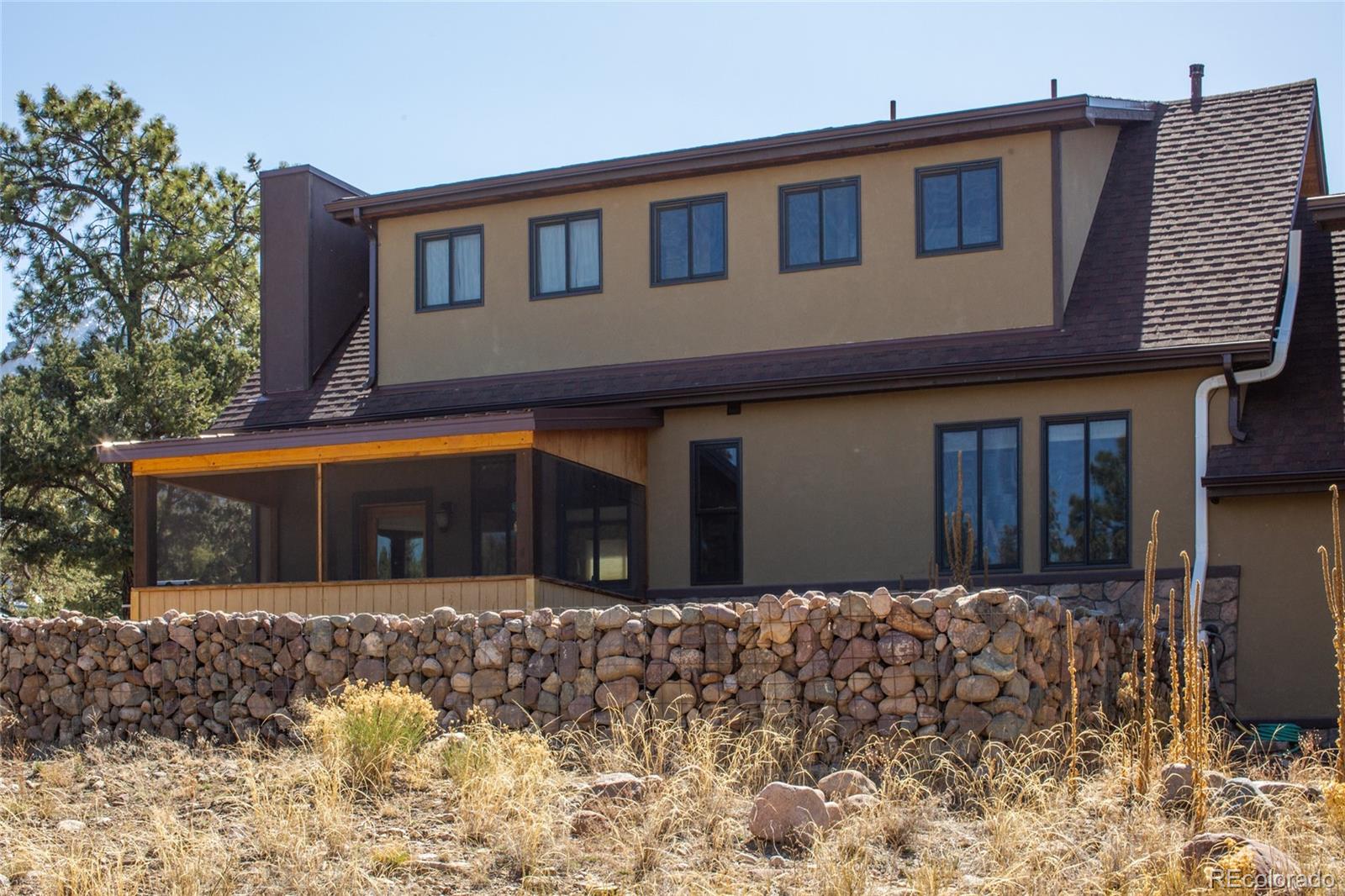 147 Moonlight Way Crestone, CO 81131 - Photo 42 of 47 a front view of a house with a yard