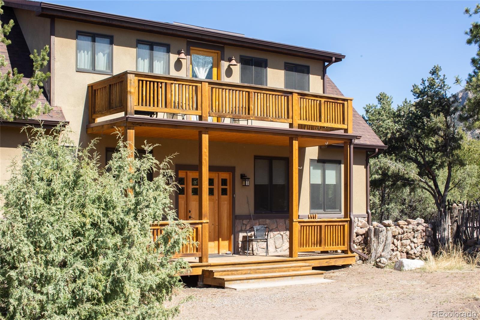 147 Moonlight Way Crestone, CO 81131 - Photo 5 of 47 front view of a house with a yard