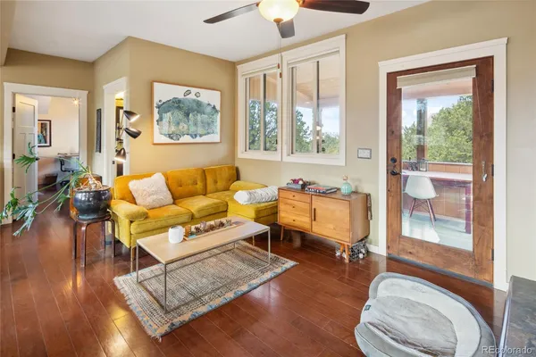 a living room with furniture and a window