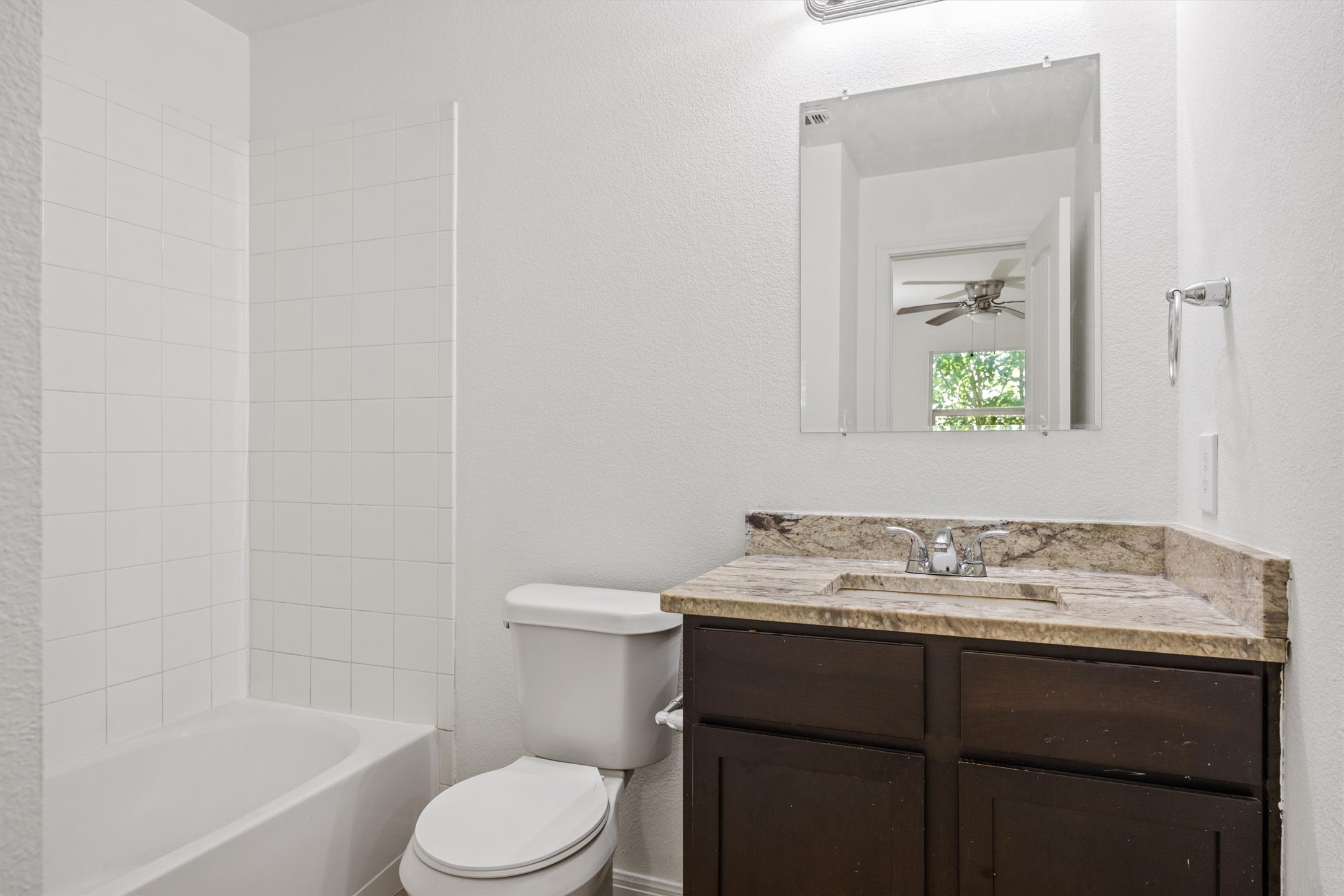 4516 Kind Way, Unit 253 Austin, TX 78725 - Photo 11 of 31 a bathroom with a sink toilet and vanity