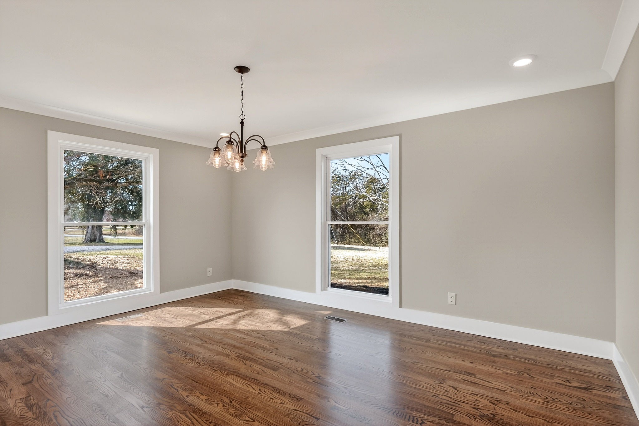 698 Mike Muncey Road McMinnville, TN 37110 - Photo 15 of 71 a view of an empty room with wooden floor and a window