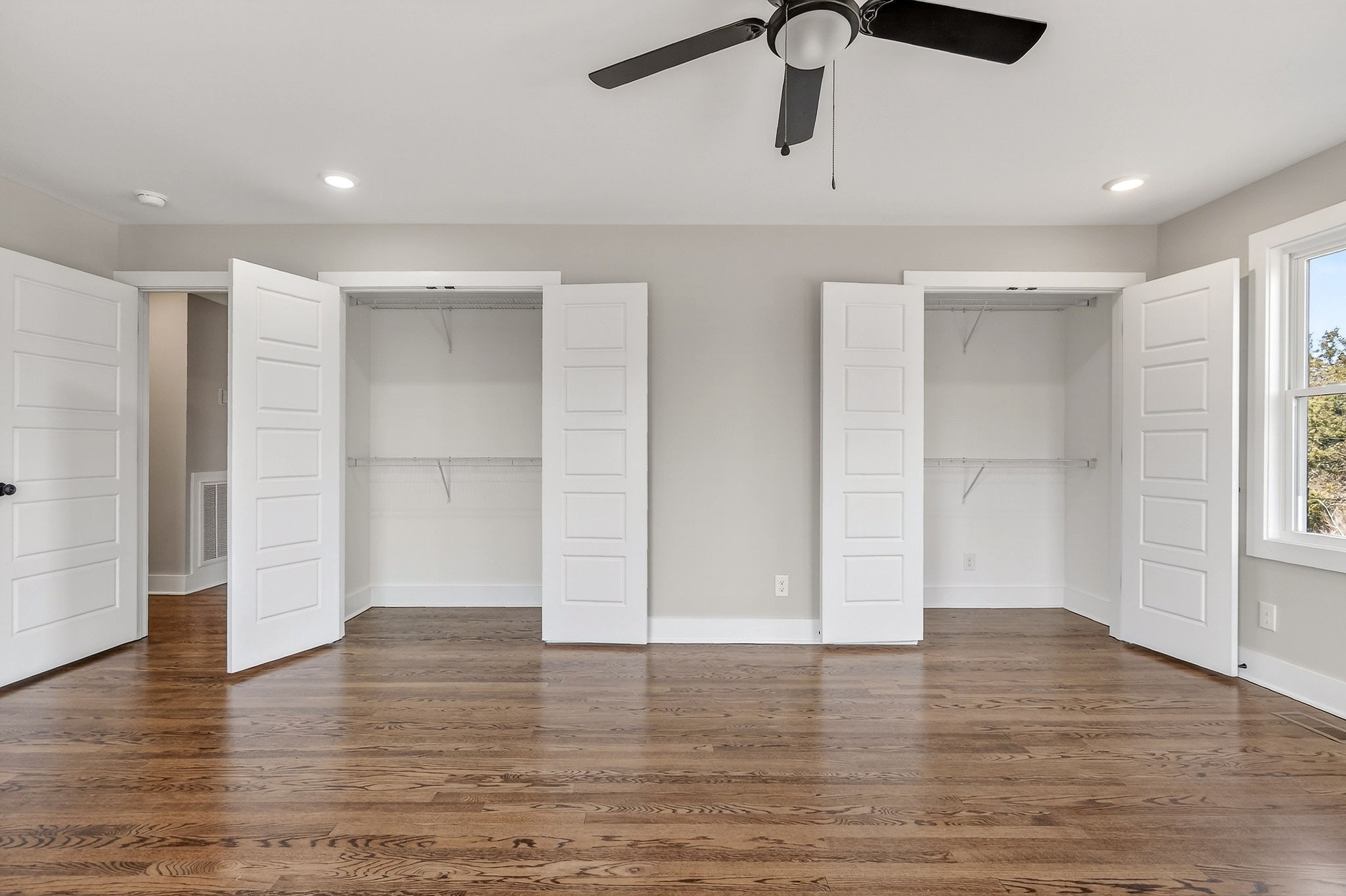 698 Mike Muncey Road McMinnville, TN 37110 - Photo 18 of 71 a view of an empty room with wooden floor and windows