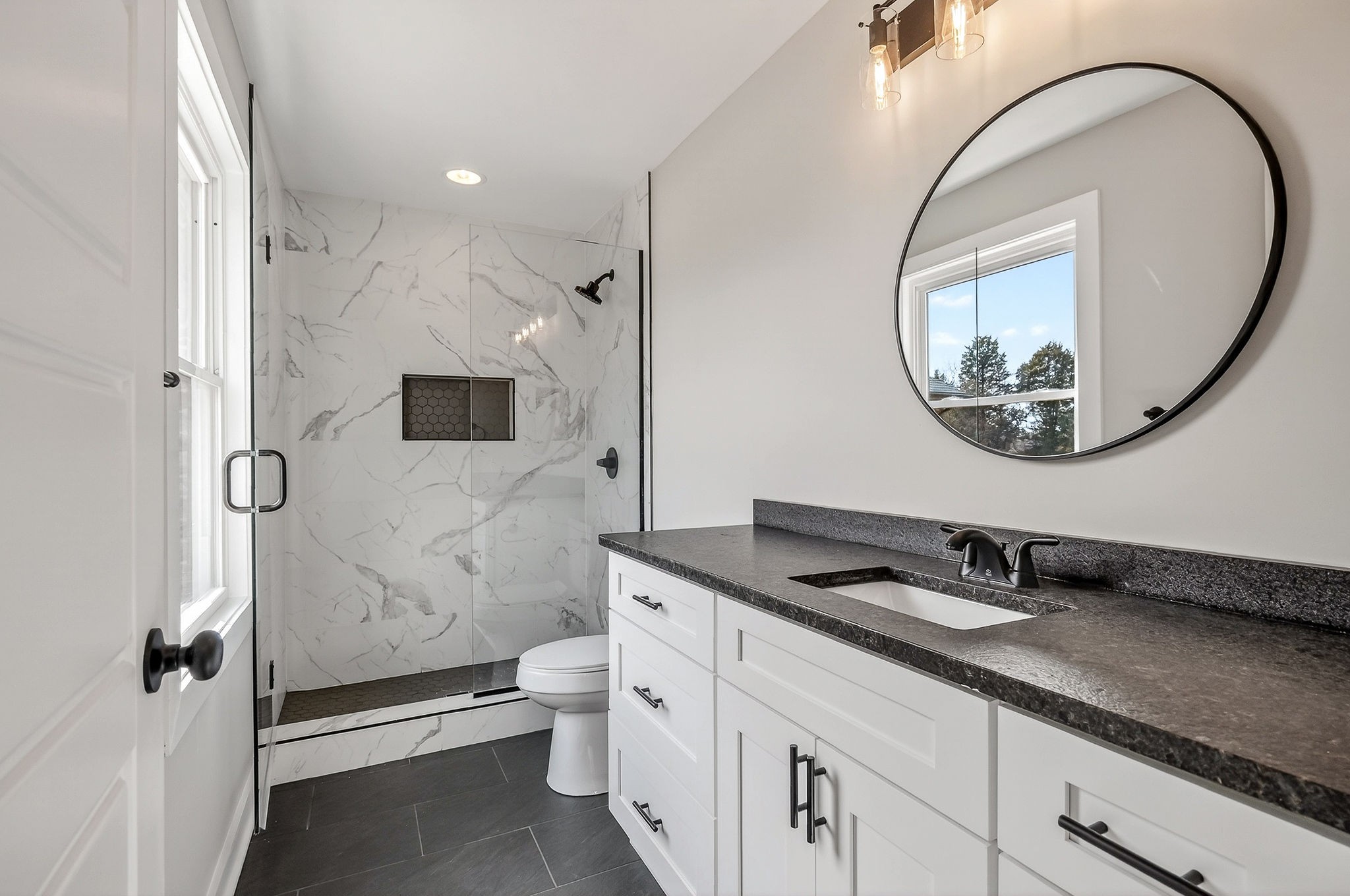 698 Mike Muncey Road McMinnville, TN 37110 - Photo 20 of 71 a bathroom with a sink and a mirror
