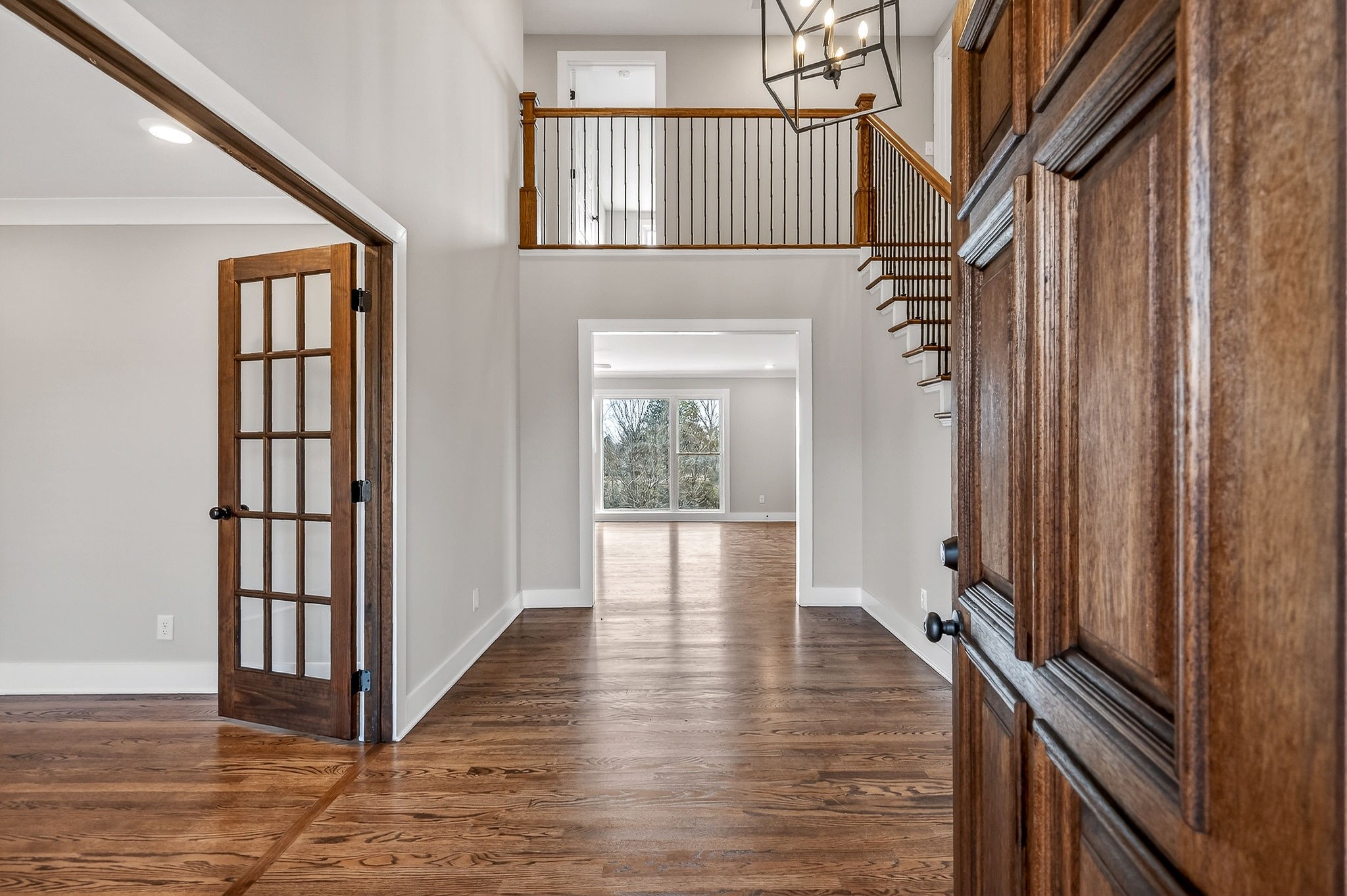698 Mike Muncey Road McMinnville, TN 37110 - Photo 2 of 71 a view of a hallway with wooden floor and staircase