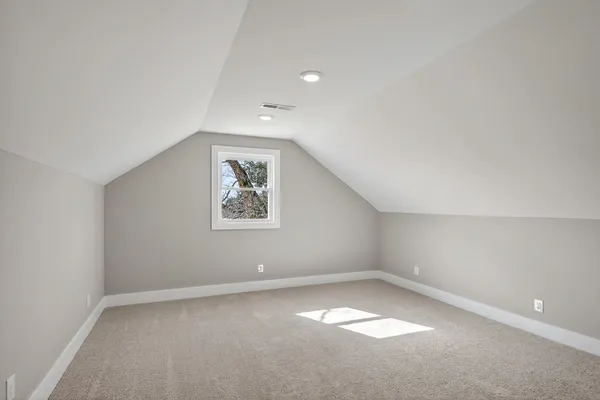 a bathroom with a shower and a mirror