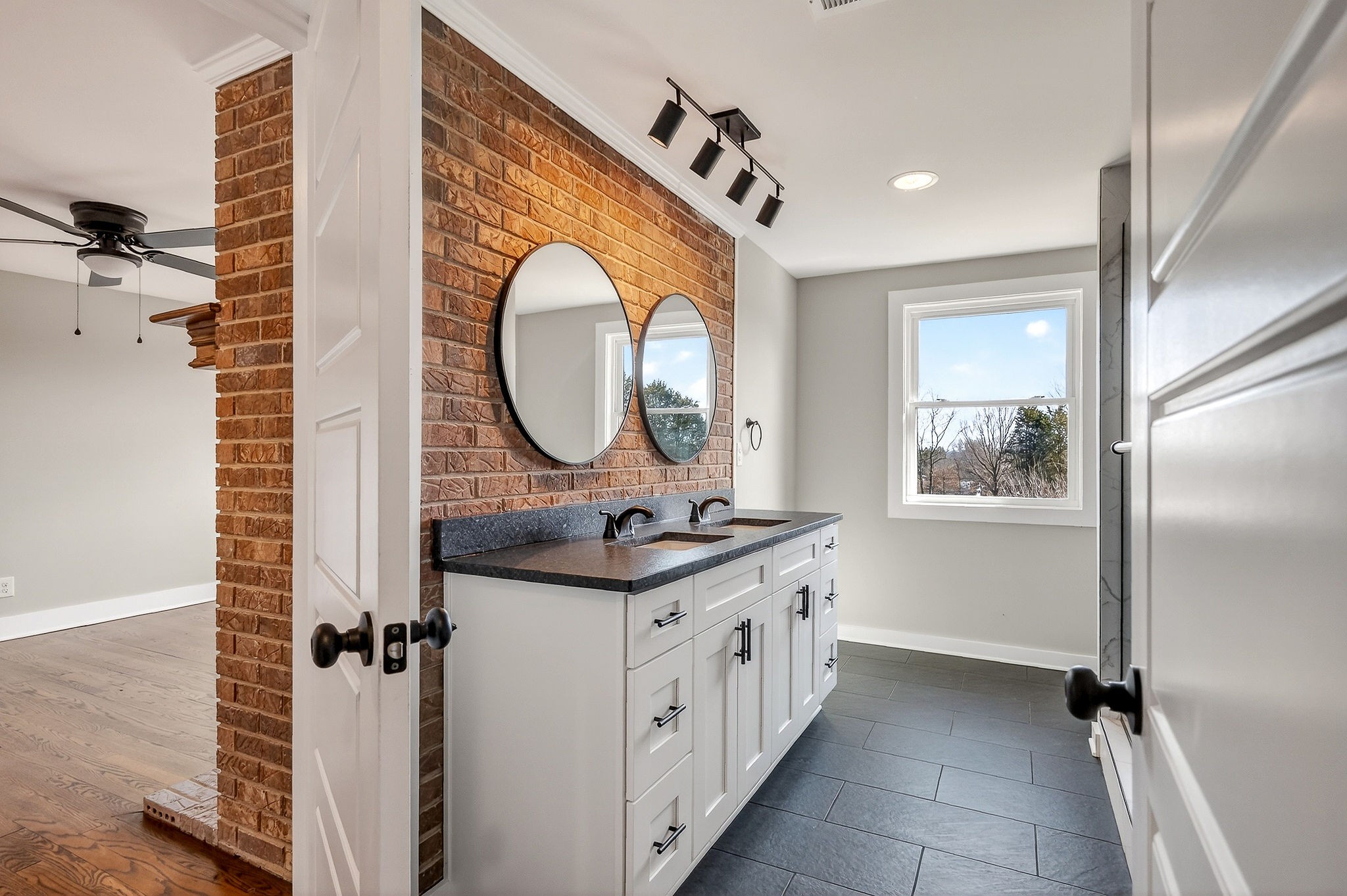 698 Mike Muncey Road McMinnville, TN 37110 - Photo 31 of 71 a bathroom with a sink and a mirror
