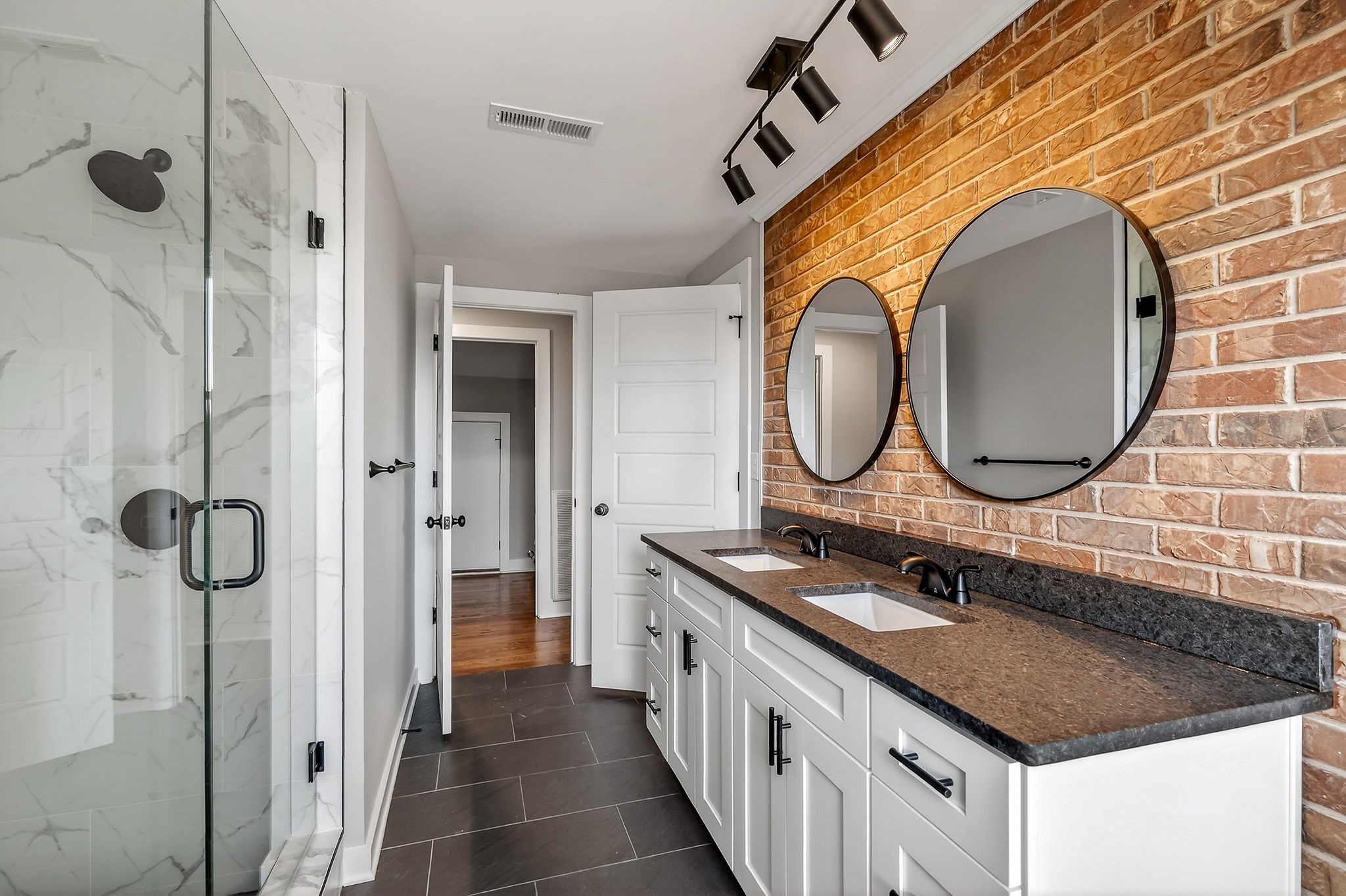 698 Mike Muncey Road McMinnville, TN 37110 - Photo 32 of 71 a bathroom with a granite countertop double vanity sink and a mirror