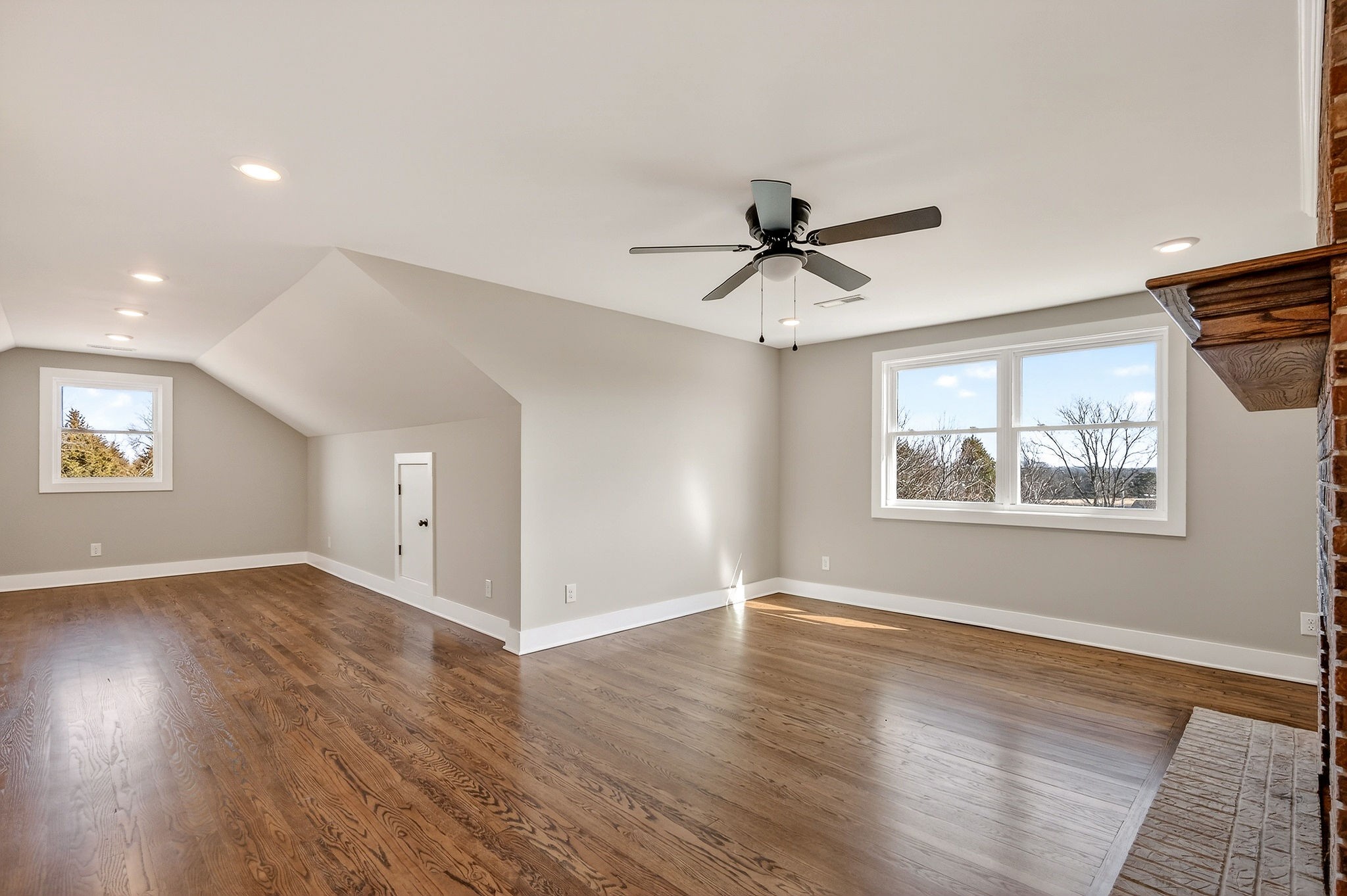 698 Mike Muncey Road McMinnville, TN 37110 - Photo 35 of 71 a view of an empty room with wooden floor and a window