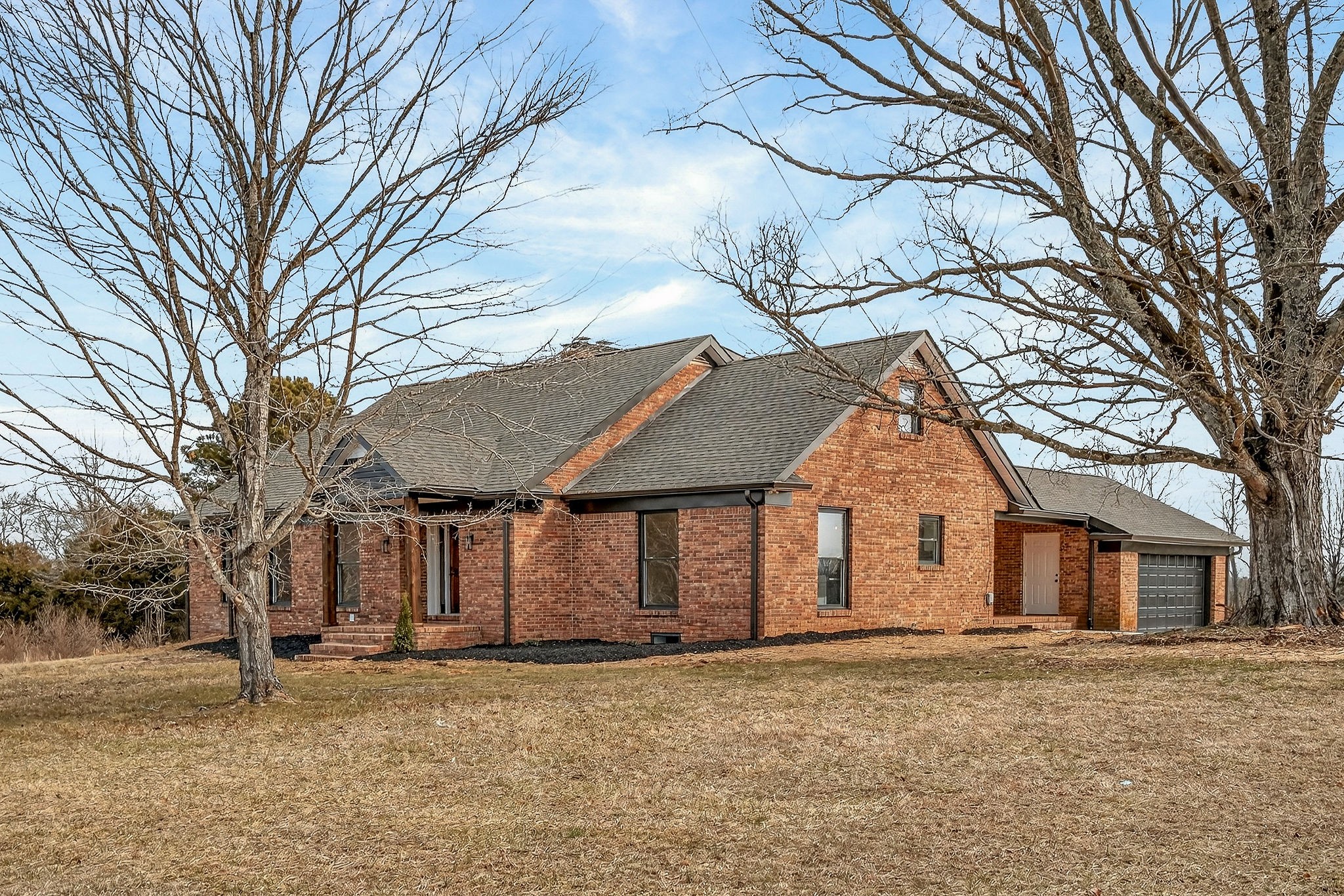 698 Mike Muncey Road McMinnville, TN 37110 - Photo 67 of 71 a front view of a house with a yard