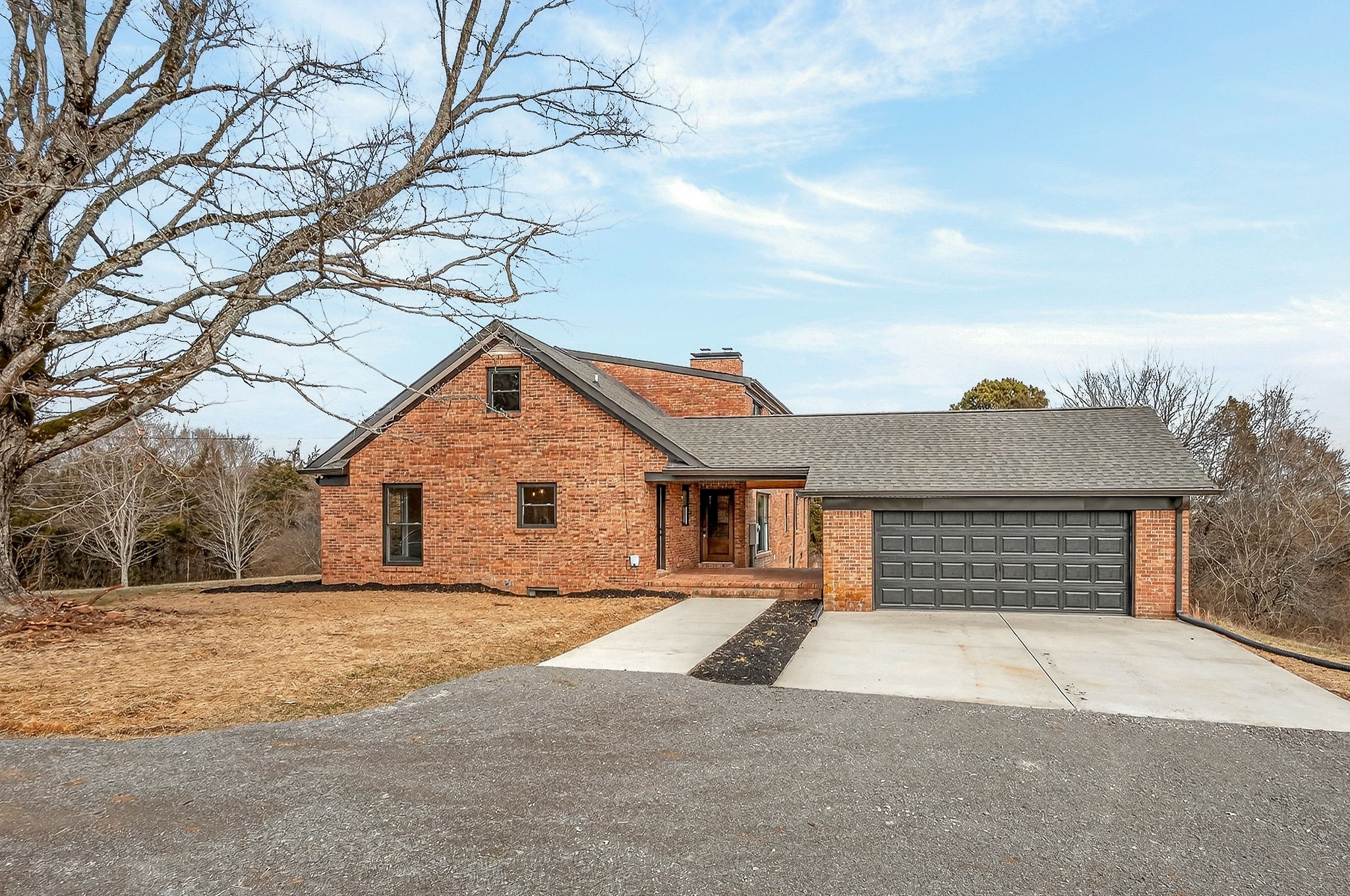 698 Mike Muncey Road McMinnville, TN 37110 - Photo 69 of 71 a front view of a house with a yard and garage