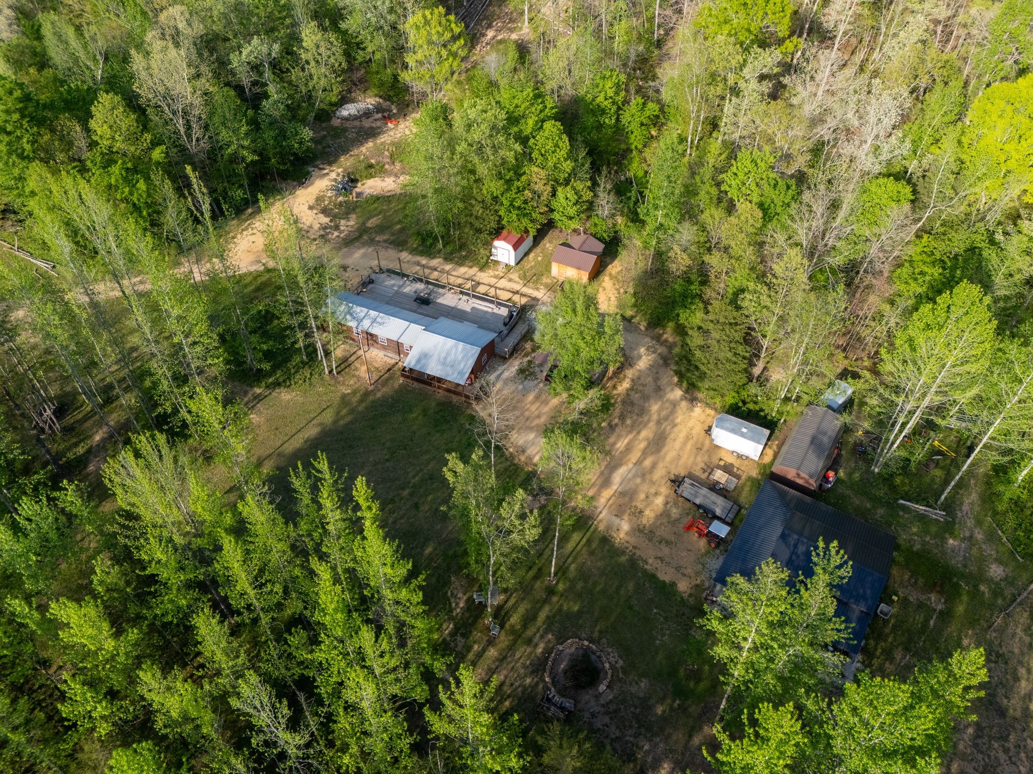 664 Russ Valley Road Lobelville, TN 37097 - Photo 53 of 63 a backyard of a house with lots of green space