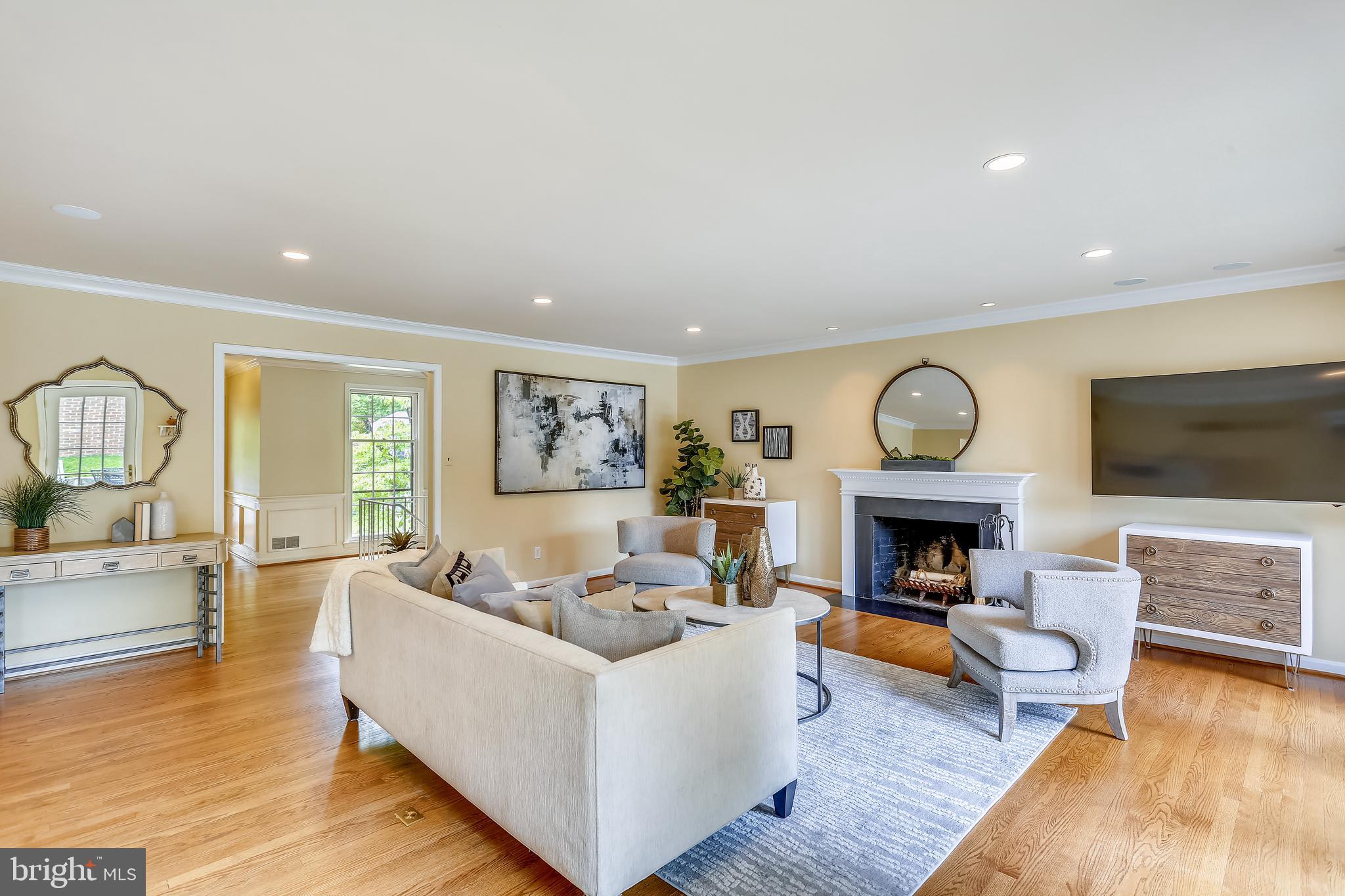 4412 Boxwood Road Bethesda, MD 20816 - Photo 11 of 77 Living room with fireplace opens to kitchen