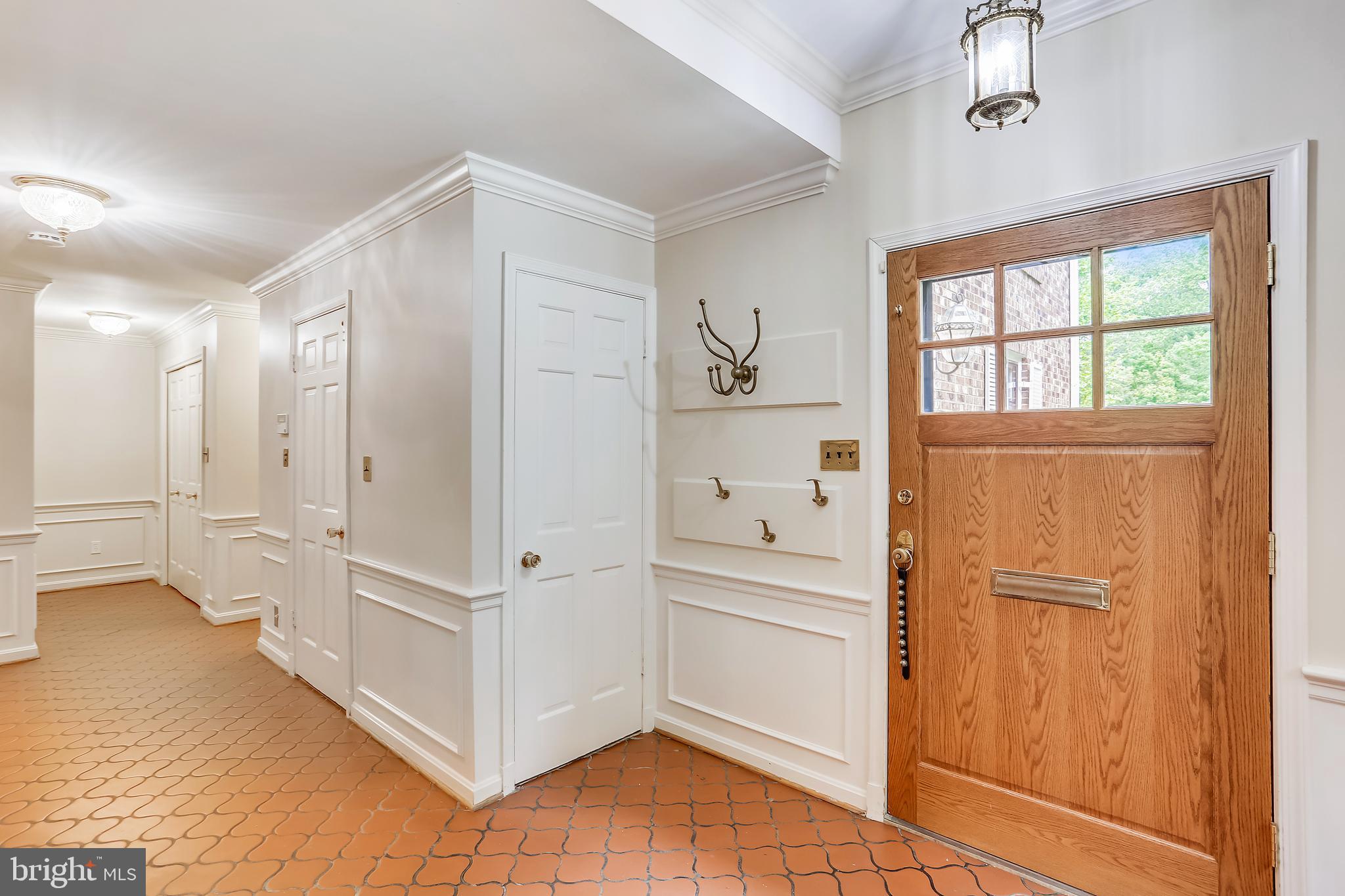 4412 Boxwood Road Bethesda, MD 20816 - Photo 14 of 77 Lower level foyer with elevator & garage access