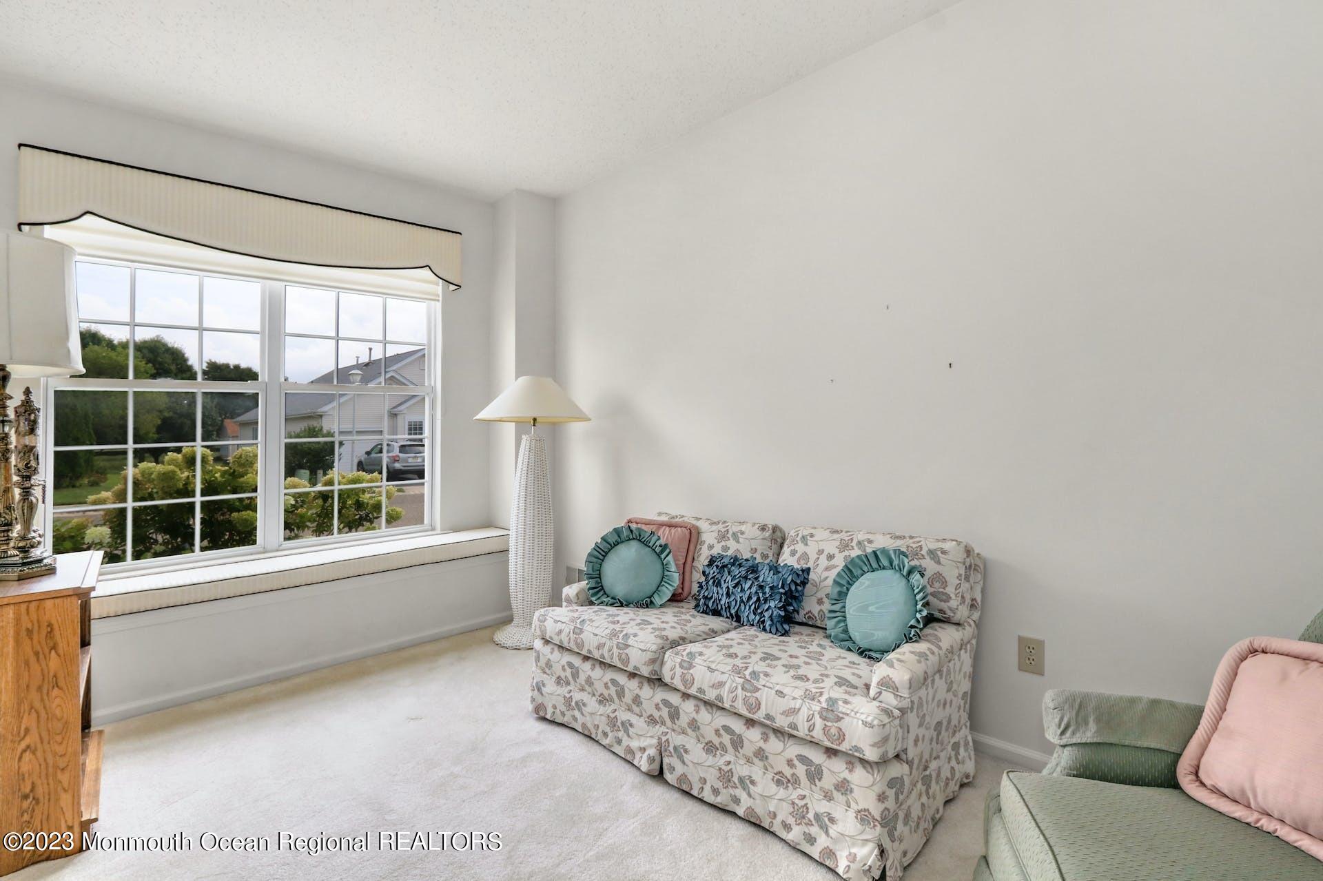 54 Sandpiper Road Barnegat, NJ 08005 - Photo 15 of 27 a living room with furniture and a large window