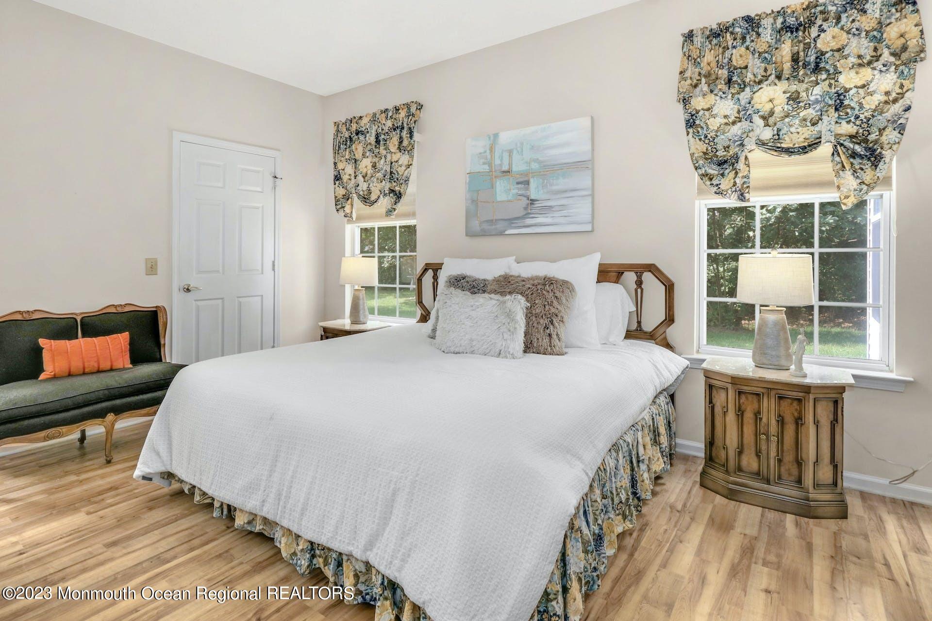 54 Sandpiper Road Barnegat, NJ 08005 - Photo 18 of 27 a bedroom with a bed and a large window